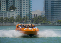 The jet boat taking a group on a thrilling ride.